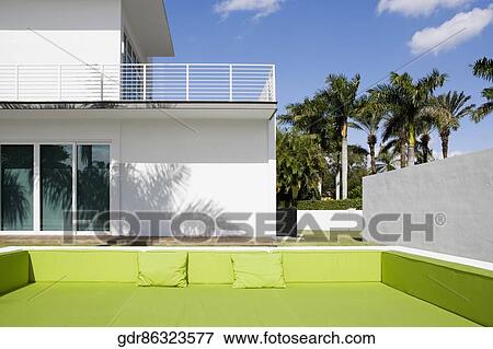 Couch in front of a building View Large Photo Image Stock Photo - Couch in front of a building. Fotosearch