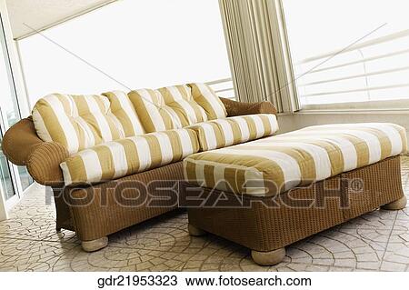 Couch with a footstool View Large Photo Image Stock Image - Couch with a footstool. Fotosearch