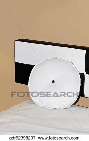 Cushion on the bed View Large Photo Image Stock Photo - Cushion on the bed. Fotosearch