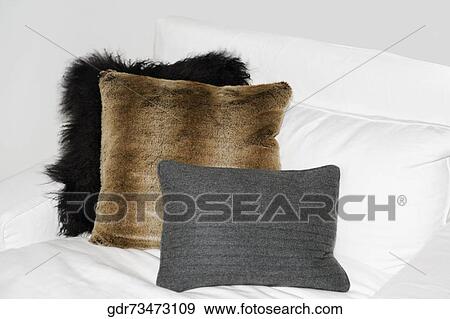 Cushions on the bed View Large Photo Image Stock Photo - Cushions on the bed. Fotosearch