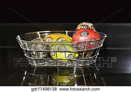 Stock Photo - Decorative balls in a basket. Fotosearch