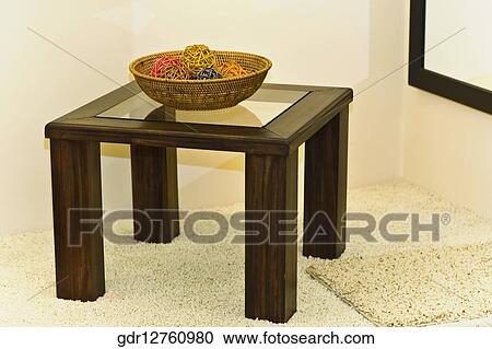 Decorative balls in a wicker basket on a table View Large Photo Image Stock Image - Decorative balls in a wicker basket on a table. Fotosearch