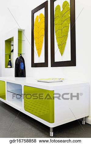 Decorative urn on a sideboard in a living room View Large Photo Image Stock Photo - Decorative urn on a sideboard in a living room. Fotosearch