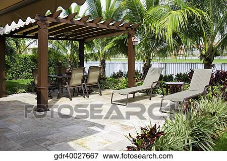 Dining table under a shed View Large Photo Image Stock Photo - Dining table under a shed. Fotosearch