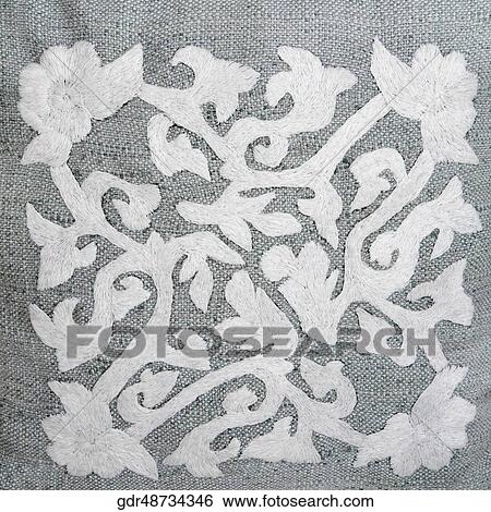 Stock Photograph - Embroidery of flowers on a textile. Fotosearch
