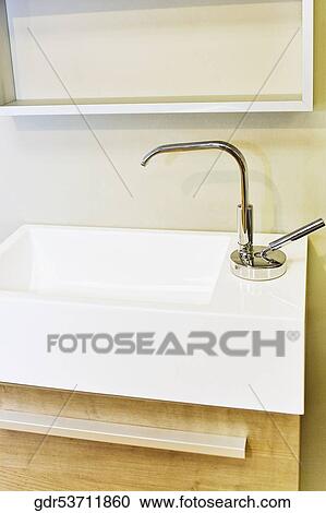 Stock Image - Faucet on a bathroom sink. Fotosearch