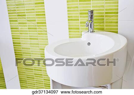 Faucet on a bathroom sink View Large Photo Image Stock Photo - Faucet on a bathroom sink. Fotosearch