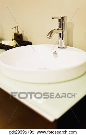 Faucet on a bathroom sink View Large Photo Image Stock Photography - Faucet on a bathroom sink. Fotosearch