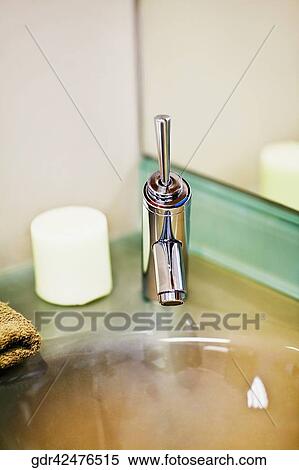 Faucet on a bathroom sink View Large Photo Image Stock Photography - Faucet on a bathroom sink. Fotosearch