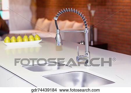 Faucet on a kitchen sink View Large Photo Image Picture - Faucet on a kitchen sink. Fotosearch