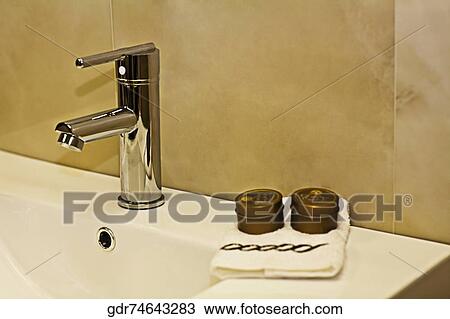 Faucet on a wash bowl in the bathroom View Large Photo Image Stock Image - Faucet on a wash bowl in the bathroom. Fotosearch