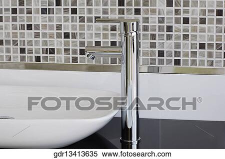 Faucet on a wash bowl in the bathroom View Large Photo Image Stock Photography - Faucet on a wash bowl in the bathroom. Fotosearch