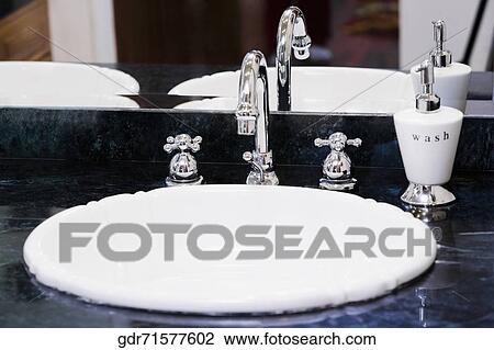 Faucet on a wash bowl View Large Photo Image Stock Image - Faucet on a wash bowl. Fotosearch