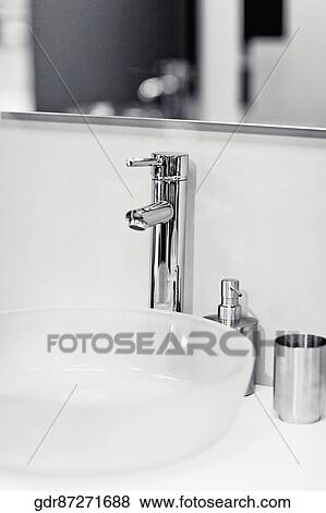 Stock Photo - Faucet on a wash bowl. Fotosearch