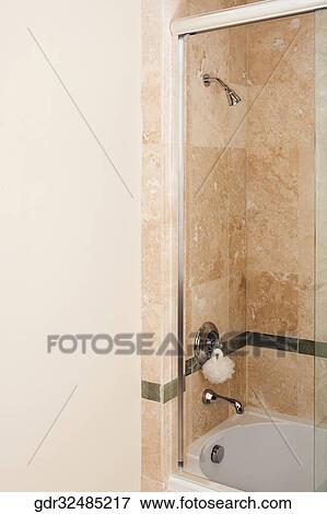 Faucet over a bathtub View Large Photo Image Stock Photo - Faucet over a bathtub. Fotosearch