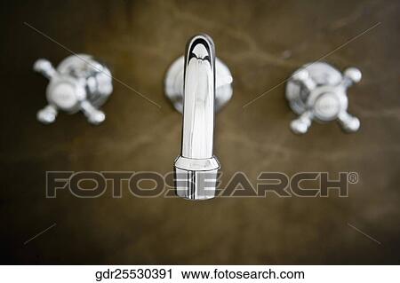 Faucets in a bathroom View Large Photo Image Stock Image - Faucets in a bathroom. Fotosearch