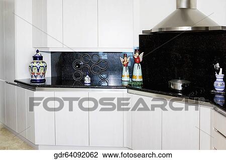 Figurines on a kitchen counter View Large Photo Image Stock Image - Figurines on a kitchen counter. Fotosearch