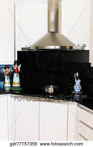 Figurines on a kitchen counter View Large Photo Image Stock Photograph - Figurines on a kitchen counter. Fotosearch