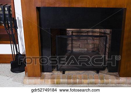 Fireplace in a living room View Large Photo Image Picture - Fireplace in a living room. Fotosearch