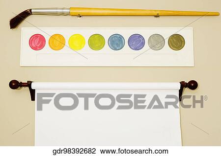 Stock Image - Flipchart and palette with a paintbrush on a wall. Fotosearch
