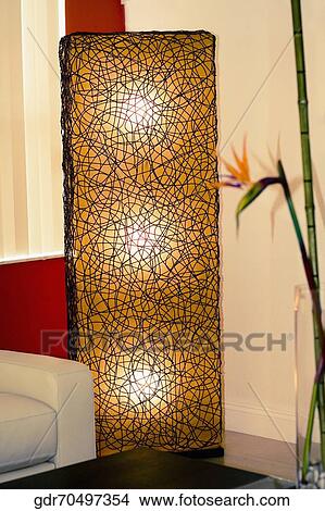 Floor lamp in a living room View Large Photo Image Picture - Floor lamp in a living room. Fotosearch