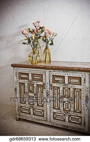 Flower vases on a sideboard View Large Photo Image Stock Image - Flower vases on a sideboard. Fotosearch