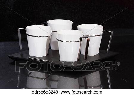 Four coffee cups on a tray View Large Photo Image Stock Photo - Four coffee cups on a tray. Fotosearch