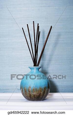 Stock Image - Fragrance sticks in a pot. Fotosearch