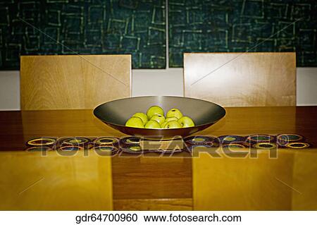 Fruits in a bowl on a dining table View Large Photo Image Stock Image - Fruits in a bowl on a dining table. Fotosearch