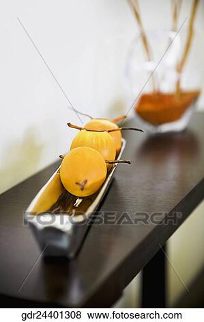 Fruits in a tray on a table View Large Photo Image Stock Photo - Fruits in a tray on a table. Fotosearch