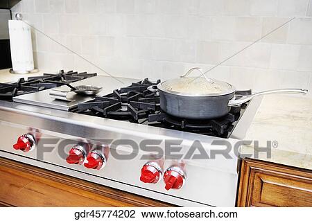 Frying pan on a gas stove View Large Photo Image Stock Image - Frying pan on a gas stove. Fotosearch