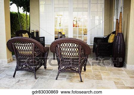 Stock Photo - Furniture under a patio. Fotosearch