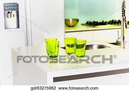 Glasses on a kitchen counter View Large Photo Image Stock Image - Glasses on a kitchen counter. Fotosearch