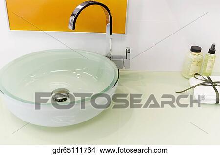 High angle view of a bathroom sink with toiletries View Large Photo Image Picture - High angle view of a bathroom sink with toiletries. Fotosearch