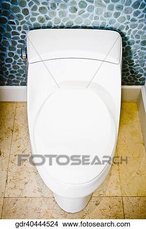 High angle view of a closed toilet bowl View Large Photo Image Picture - High angle view of a closed toilet bowl. Fotosearch