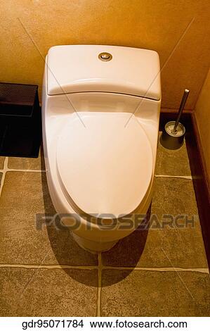 Picture - High angle view of a closed toilet bowl. Fotosearch