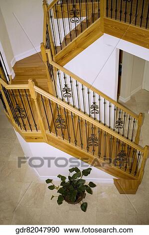 High angle view of a staircase in a house View Large Photo Image Stock Image - High angle view of a staircase in a house. Fotosearch