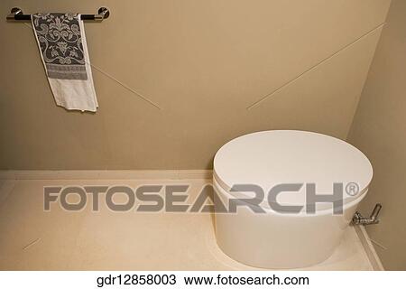 Stock Image - High angle view of a toilet bowl in the bathroom. Fotosearch