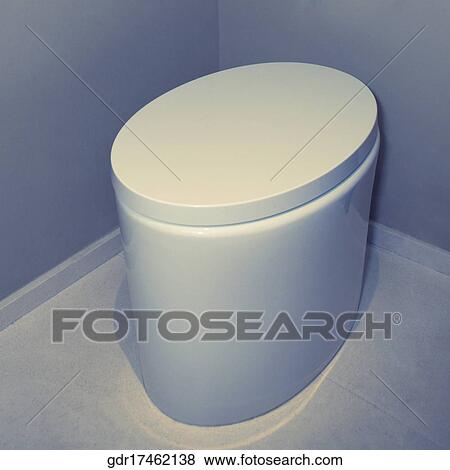 Stock Photo - High angle view of a toilet bowl in the bathroom. Fotosearch