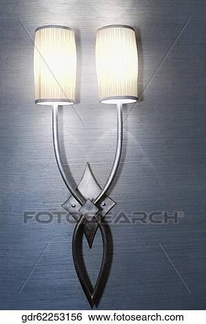 Illuminated lamp mounted on the wall View Large Photo Image Stock Photograph - Illuminated lamp mounted on the wall. Fotosearch