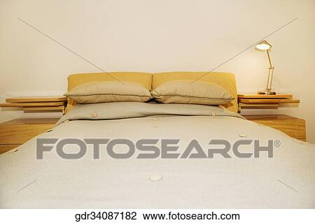 Stock Image - Interiors of a bedroom. Fotosearch
