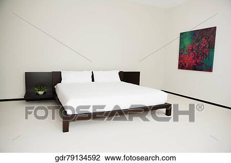 Stock Image - Interiors of a bedroom. Fotosearch