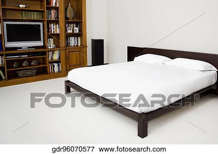 Stock Photo - Interiors of a bedroom. Fotosearch
