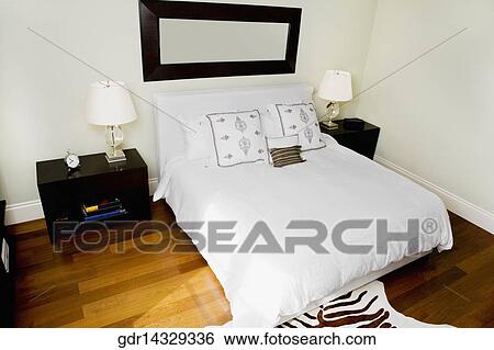 Stock Photograph - Interiors of a bedroom. Fotosearch