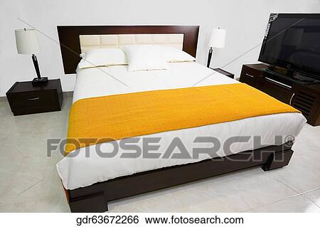 Stock Photograph - Interiors of a bedroom. Fotosearch
