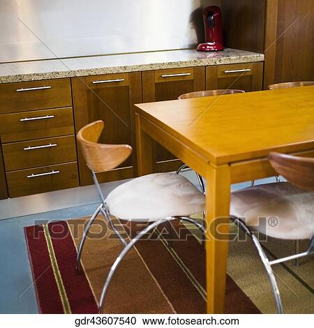 Stock Image - Interiors of a dining room. Fotosearch