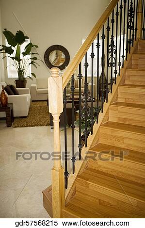 Stock Photography - Interiors of a living room with a staircase. Fotosearch