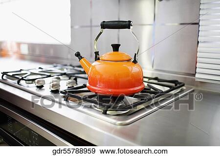 Kettle on a stove burner View Large Photo Image Stock Photo - Kettle on a stove burner. Fotosearch