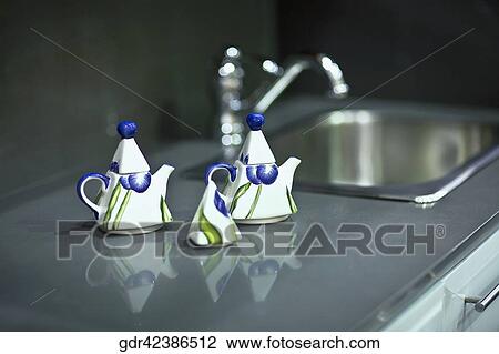 Kettles on a kitchen counter View Large Photo Image Stock Image - Kettles on a kitchen counter. Fotosearch