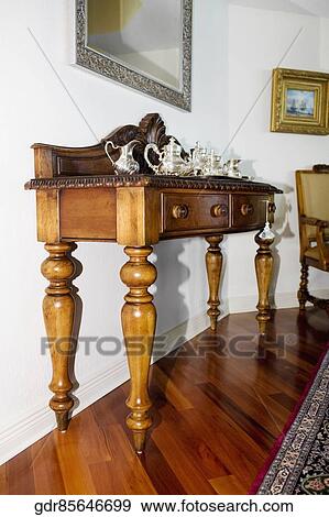 Kettles on a sideboard in a living room View Large Photo Image Stock Photo - Kettles on a sideboard in a living room. Fotosearch